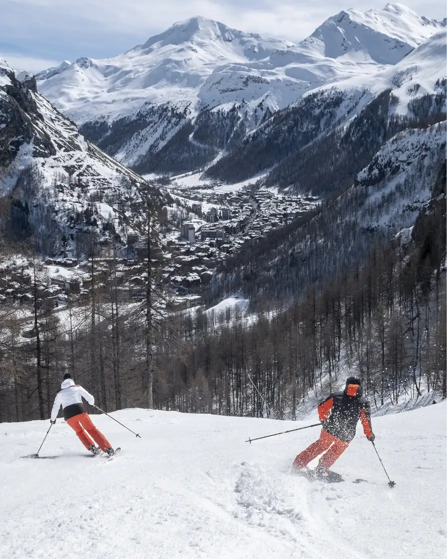 Two people skiing