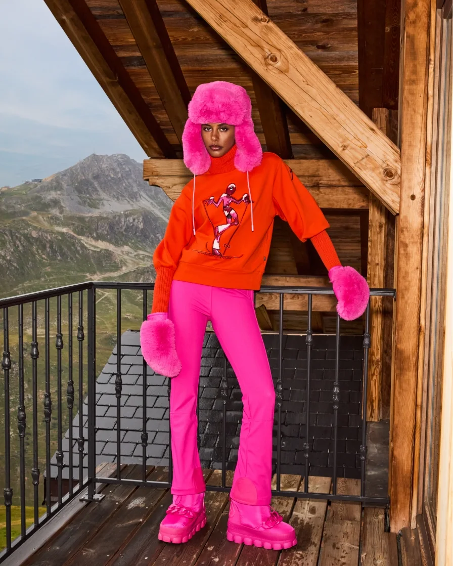 Woman in red and pink skiwear