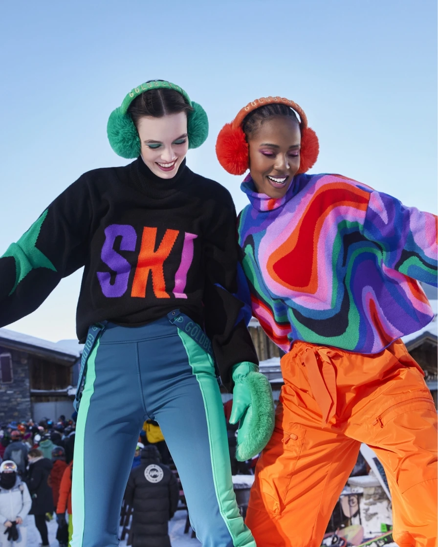 Two people in bright skiwear