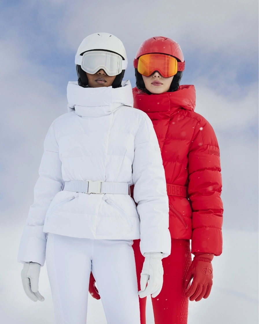 Two people in skiwear in snow