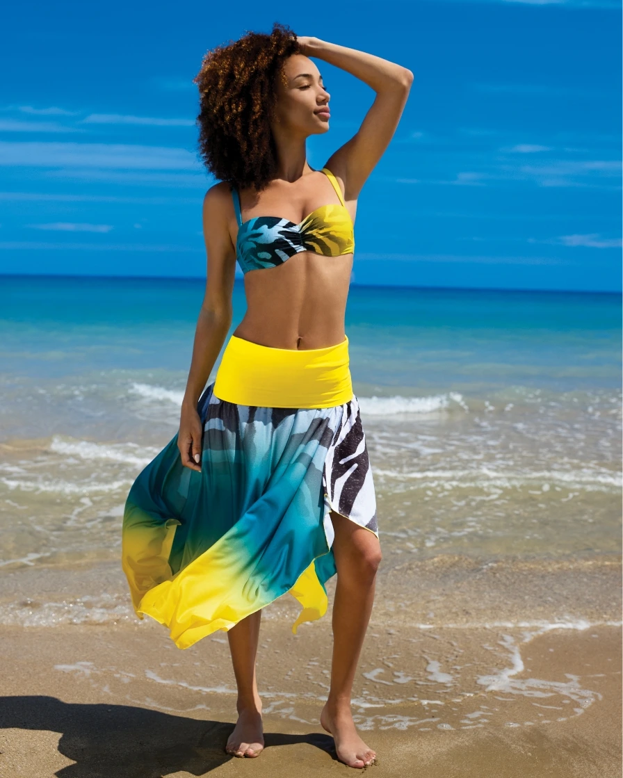 Woman on the beach in colourful swimwear